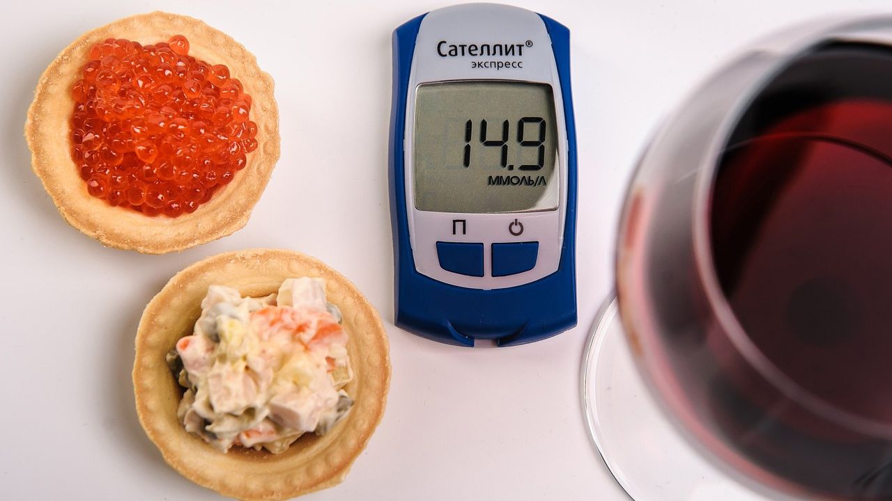 Glucose meter, wine, and snacks