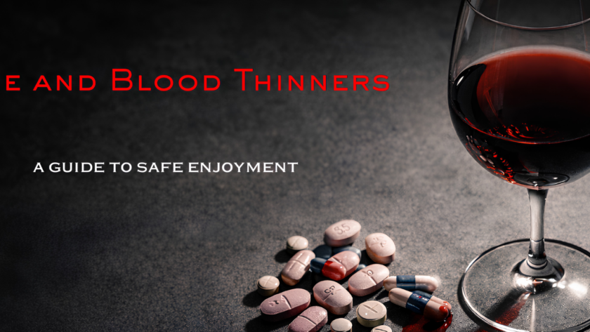 A glass of red wine beside a scattered mix of pills on a dark surface.